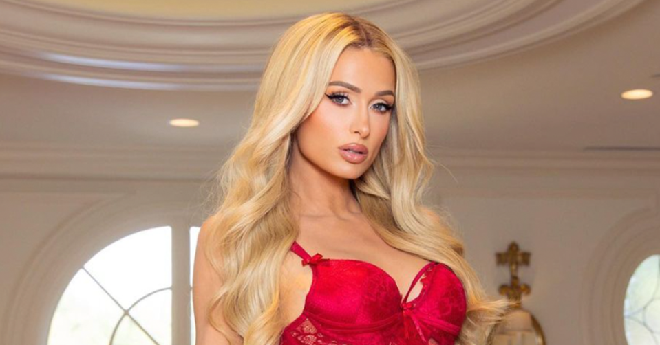 Paris Hilton poses in red lingerie. 