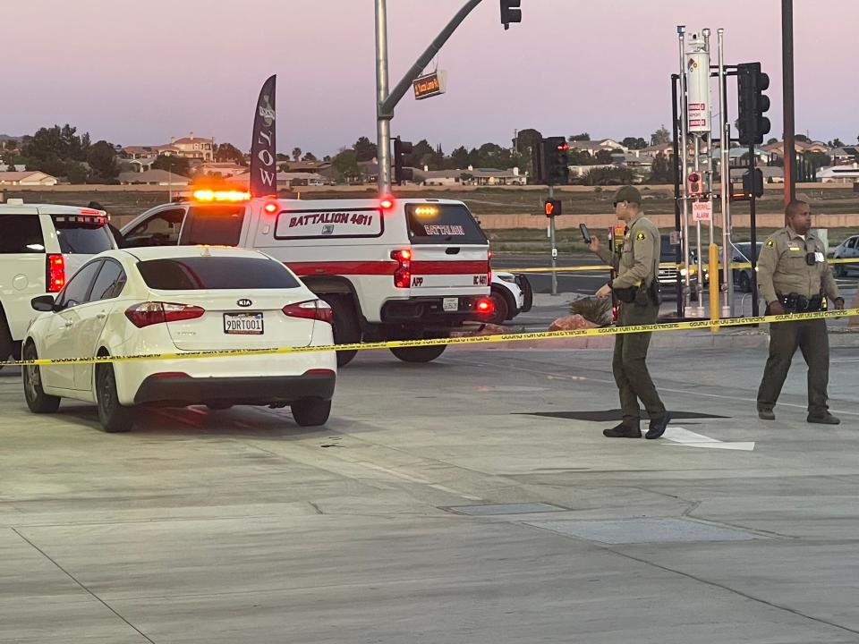 San Bernardino County sheriff's deputies investigate the scene of a shooting at Apple Valley Road and Yucca Loma Road in Apple Valley on Tuesday, April 16, 2024.