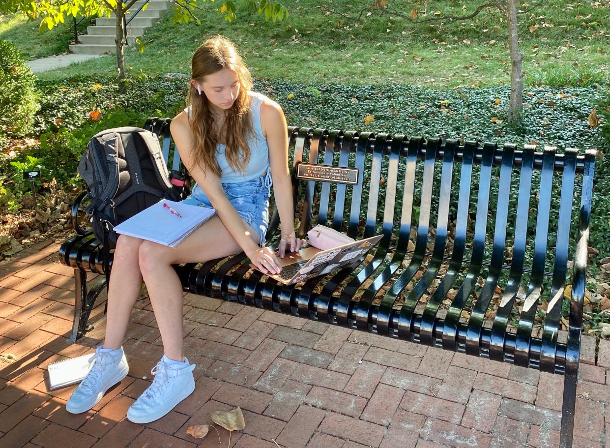 Kari Wichmann, freshman marketing student from Minnesota, studies on Francis Quadrangle on her first day of classes at the University of Missouri.