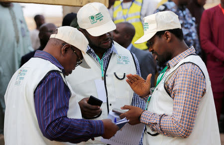 Foreign election observers talk during the Nigeria's presidential election at a polling station in Daura, Katsina State, Nigeria, February 23, 2019. REUTERS/Afolabi Sotunde