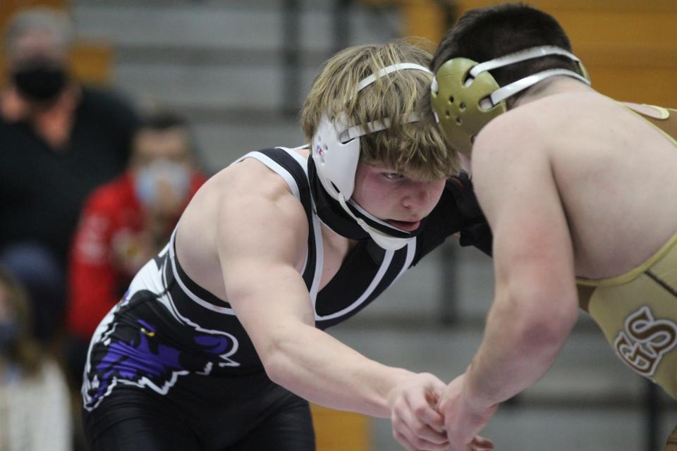 John Jay-Cross River's Cameron Wierl wrestles against Clarkstown South's Liam Brew in the 152-pound match of the Section 1 Division I Dual Meet Tournament quarterfinals.