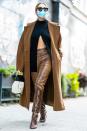 <p>Ashley Benson wears snakeskin boots and matching leather trousers while walking through N.Y.C. on Monday. </p>