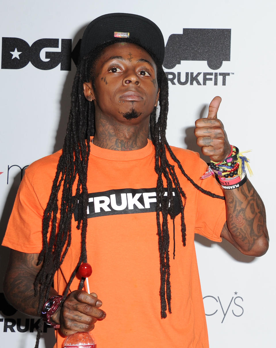 FILE - In this June 1, 2012 file photo shows Grammy Award winning Hip Hop Icon, Lil Wayne, celebrating the launch of his contemporary clothing line, TRUKFIT at Macy's, in Los Angeles. (Photo by Katy Winn/Invision, File)