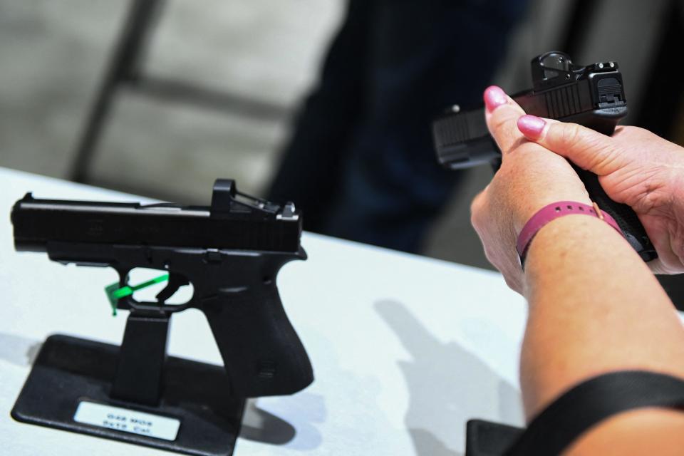 An attendee holds a Glock Ges.m.b.H. GLOCK 19 Gen5 9mm pistol during the National Rifle Association (NRA) Annual Meeting at the George R. Brown Convention Center, in Houston on May 28, 2022. Glock pistols are the most traced firearm used in crime nationwide.