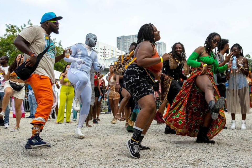 People dance to live music during AFROPUNK music festival at The Urban in the Historic Overtown neighborhood of Miami, Florida, on Saturday, May 21, 2022.