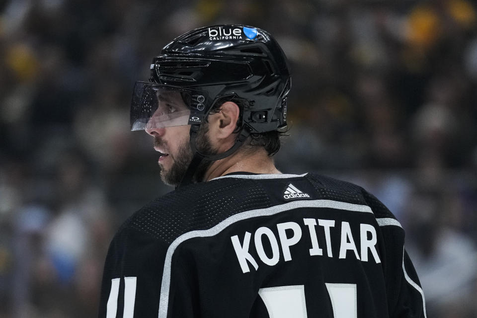 Los Angeles Kings center Anze Kopitar (11) stands on the ice during the first period of an NHL hockey game against the Boston Bruins Saturday, Oct. 21, 2023, in Los Angeles. (AP Photo/Ashley Landis)