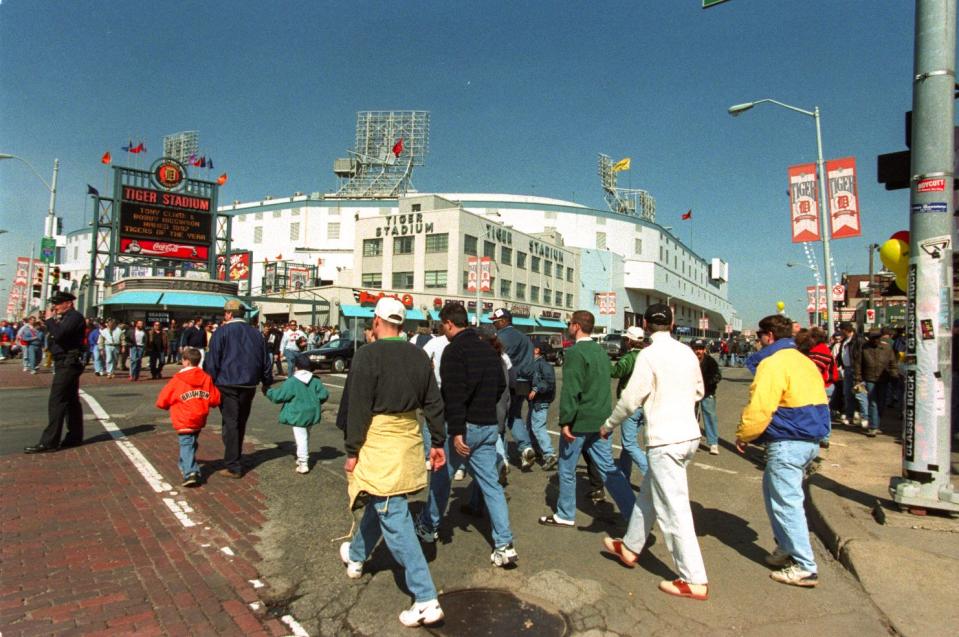 Tigers fans cross Trumbull at Michigan heading for Tiger Stadium on Opening Day in Detroit on Tuesday, April 7, 1998.