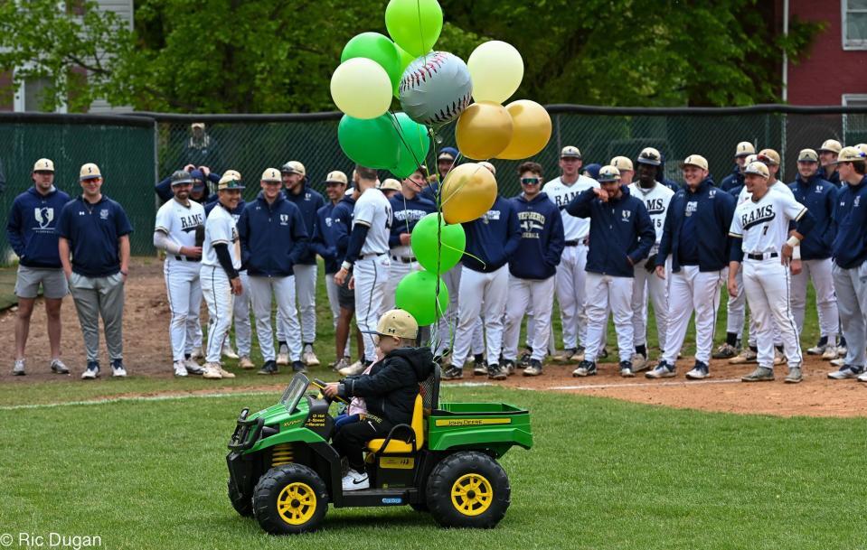 Cooper Jackson rides around the infield of Fairfax Field in his John Deere Gator that was presented to him by the Shepherd University baseball team on Tuesday.