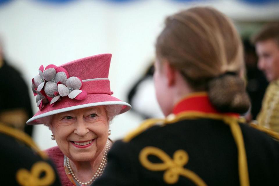 The Queen speaks to soldiers at a reception following The King's Troop Royal Horse Artillery parade. (AFP/Getty Images)