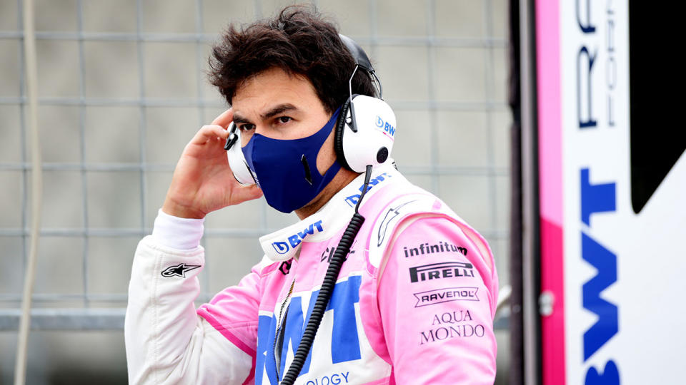 Pictured here, Sergio Perez wears a face mask amid the virus threat.