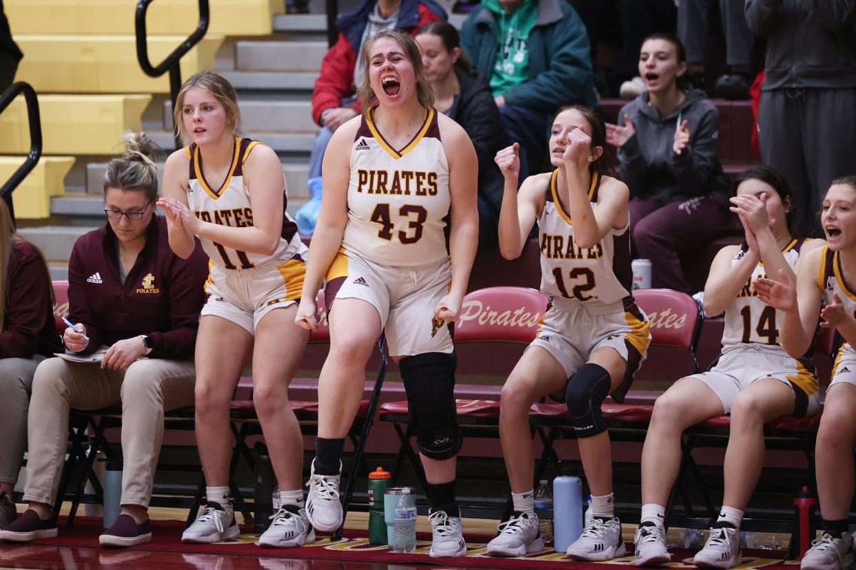 The Pirates bench erupts as teammate Cami McPeak hits a free throw from the line during Wednesday’s game against the Mogadore Wildcats.