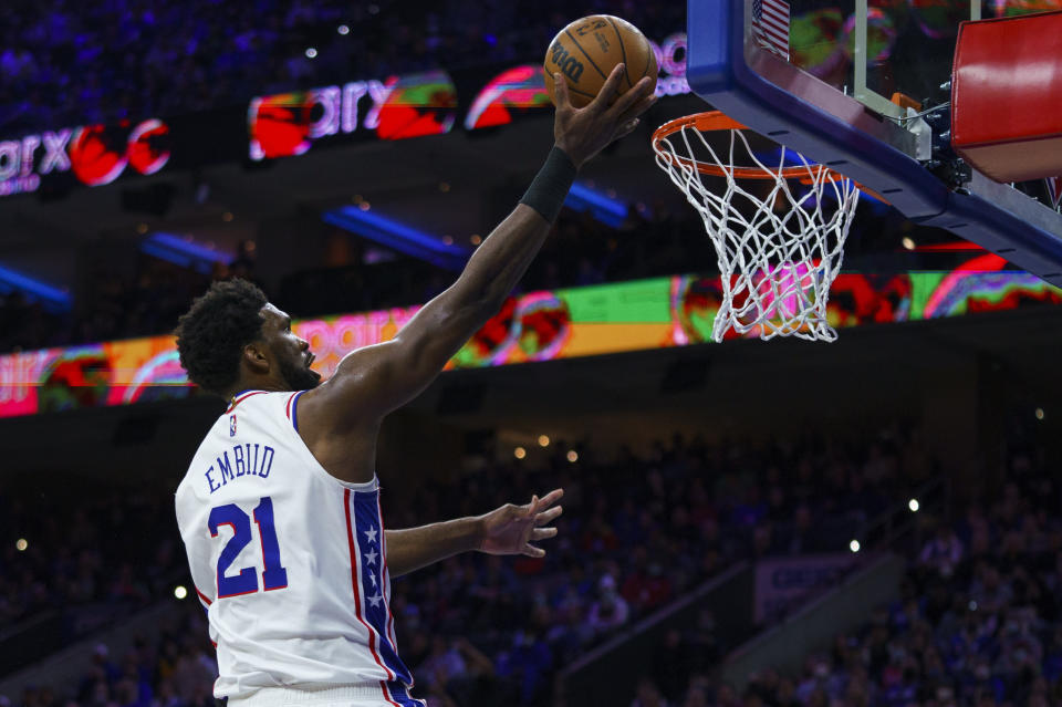 Philadelphia 76ers' Joel Embiid goes up for the shot during the second half of an NBA basketball game against the Cleveland Cavaliers, Saturday, Feb. 12, 2022, in Philadelphia. The 76ers won 103-93. (AP Photo/Chris Szagola)