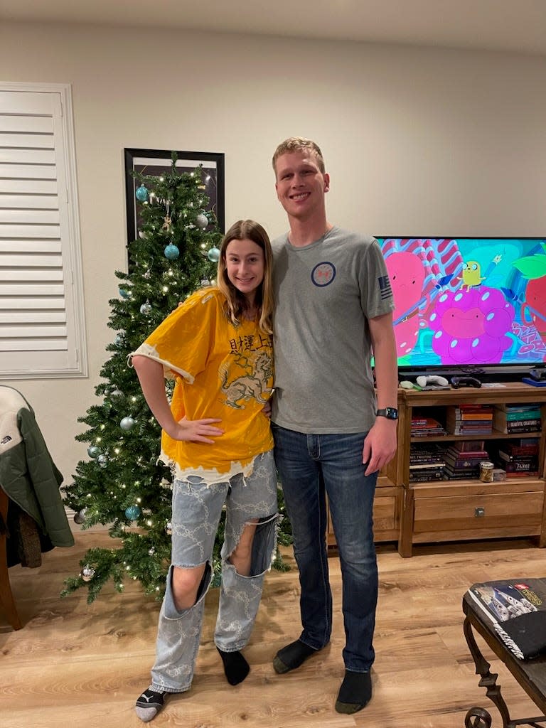 Brenna Siperko (right) with her brother, Jared. The pair have the same biological father and have over 60 siblings, some of whom they've met in person.
