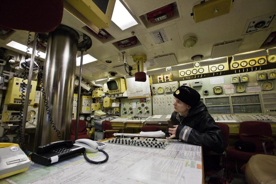 In this Thursday, Dec. 9, 2010 photo a Russian navy sailor sits at a control room of the Yekaterinburg nuclear submarine in Gadzhiyevo in the Murmansk region, Russia. A massive fire engulfed a Russian nuclear submarine at an Arctic shipyard Thursday Dec. 29, 2011, but there has been no radiation leak, or injuries, officials said. The fire at the Yekaterinburg nuclear submarine occurred while it was in dock for repairs at the Roslyakovo shipyard. The Yekaterinburg is a Delta-IV-class nuclear-powered submarine that normally carries 16 nuclear-tipped intercontinental ballistic missiles. Defense Ministry spokesman Igor Konashenkov told The Associated Press that all weapons had been unloaded from the sub and its reactor had been shutdown to safety before the repairs.