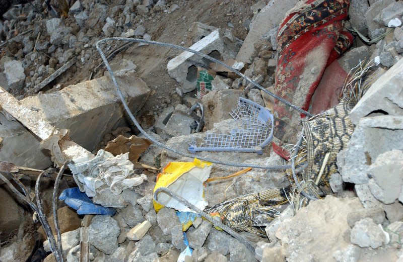 Rugs and other household items from the last safe house of Abu Musab al-Zarqawi in Hibhib, Iraq, lie among the rubble on June 8, 2006. A U.S. warplane air strike on the house killed al-Zarqawi and a group of his associates late June 7, 2006. UPI File Photo by Zach Mott/U.S. Army