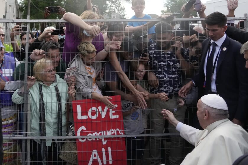 Pope Francis waves faithfuls after meeting Indigenous peoples and members of the parish community of Sacred Heart in Edmonton, Canada, Monday, July 25, 2022. Pope Francis begins a "penitential" visit to Canada to beg forgiveness from survivors of the country's residential schools, where Catholic missionaries contributed to the "cultural genocide" of generations of Indigenous children by trying to stamp out their languages, cultures and traditions. Francis set to visit the cemetery at the former residential school in Maskwacis near Edmonton. (AP Photo/Gregorio Borgia)