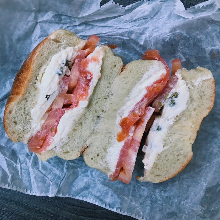 A bagel with tomato and lox
