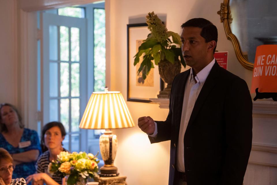 Dr. Dave Bhattacharya speaks to a Chattanooga-area gun reform group listen during a meeting at Isabel McCall's home in Lookout Mountain, Tenn., Wednesday, July 26, 2023.