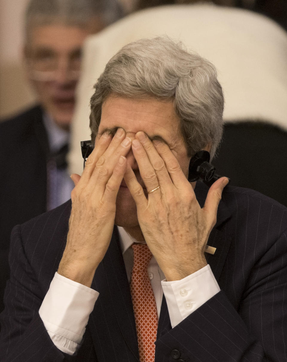 U.S. Secretary of State John Kerry touches his face during a the Conference on International Support to Libya in Rome Thursday March 6, 2014. Kerry will discuss the Ukraine crisis with foreign ministers of Italy, Britain, Germany and France ahead of an EU emergency summit in Brussels, a senior State Department official said on Thursday. (AP Photo/Alessandra Tarantino)