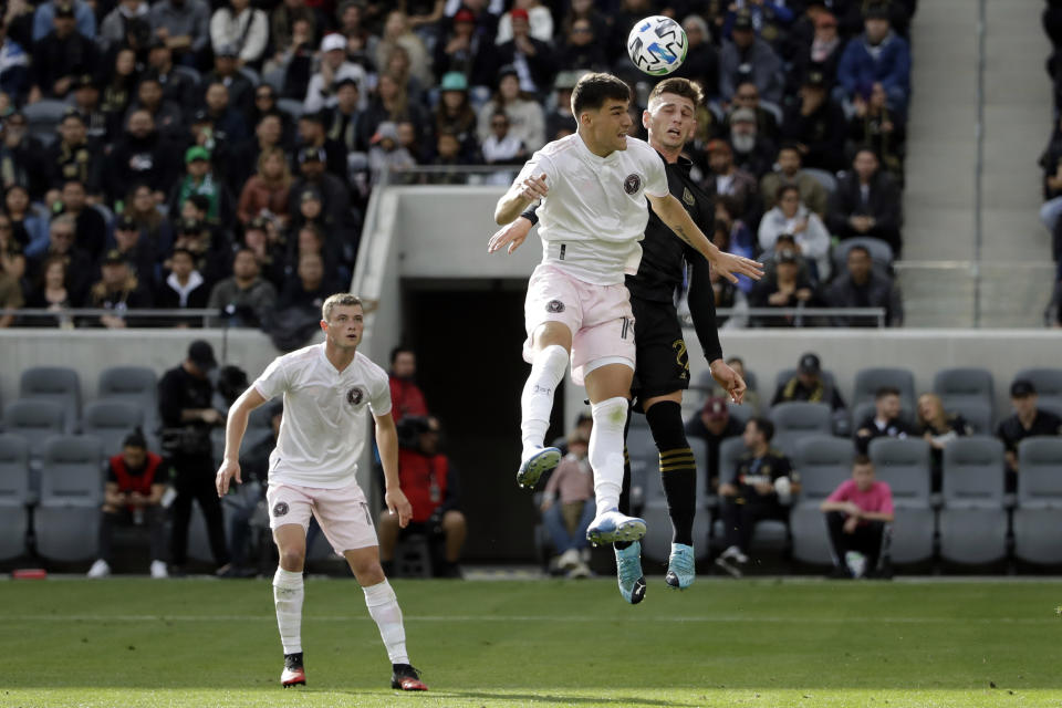 Inter Miami CF's Robbie Robinso, center left, goes up for a header as Los Angeles FC's Tristan Blackmon defends during the first half of an MLS soccer match Sunday, March 1, 2020, in Los Angeles. (AP Photo/Marcio Jose Sanchez)