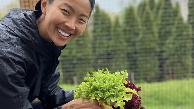 Kristen Kish holding lettuces