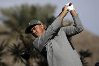 Rickie Fowler hits from the sixth tee during the first round of The American Express golf tournament at La Quinta Country Club Thursday, Jan. 16, 2020, in La Quinta, Calif. (AP Photo/Marcio Jose Sanchez)