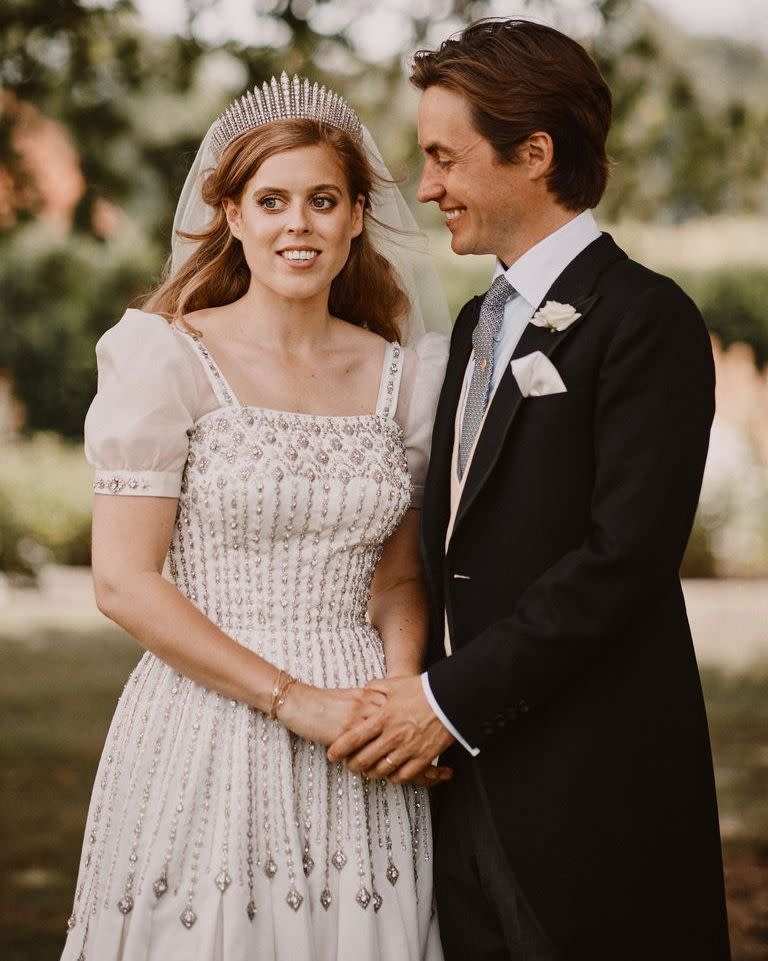 <p>On her wedding day, Princess Beatrice wore a vintage dress of the Queen's, a Norman Hartnell design, which was updated and custom fitted to her body. Naturally, she paired it with her grandmother's tiara.</p><p><strong><a href="https://www.townandcountrymag.com/society/tradition/a31085338/princess-beatrice-wedding-dress/" rel="nofollow noopener" target="_blank" data-ylk="slk:Get all the details on her look here.;elm:context_link;itc:0;sec:content-canvas" class="link ">Get all the details on her look here.</a></strong></p>