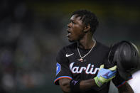 Miami Marlins' Jazz Chisholm Jr. walks to the dugout after hitting a flyout to Oakland Athletics center fielder Esteury Ruiz during the seventh inning of a baseball game Friday, May 3, 2024, in Oakland, Calif. (AP Photo/Godofredo A. Vásquez)