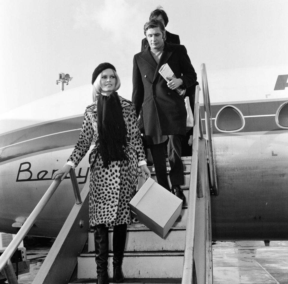 French film actress Brigitte Bardot arriving at London's Heathrow Airport with her husband Gunther Sachs, 28th November 1967.