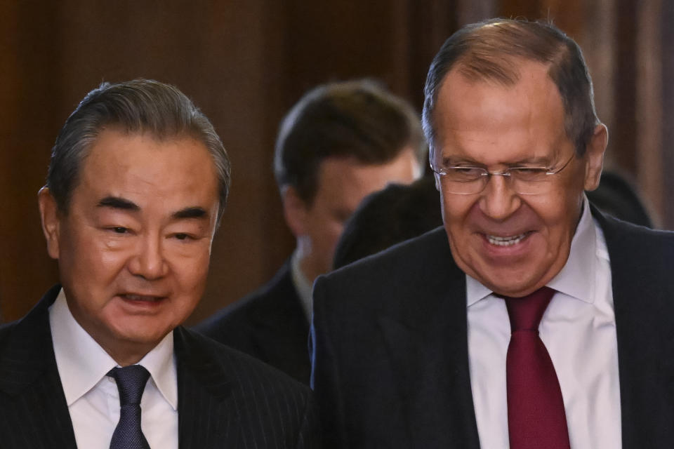 Russian Foreign Minister Sergey Lavrov, right, and the Chinese Communist Party's foreign policy chief Wang Yi enter a hall for their talks in Moscow, Russia, Wednesday, Feb. 22, 2023. (Alexander Nemenov/Pool Photo via AP)