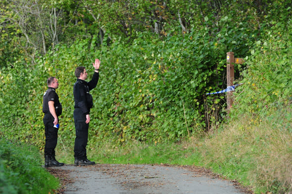 Police at the scene at Sweeney mountain near Oswestry in Shropshire, as they investigate the discovery of bones in the location.