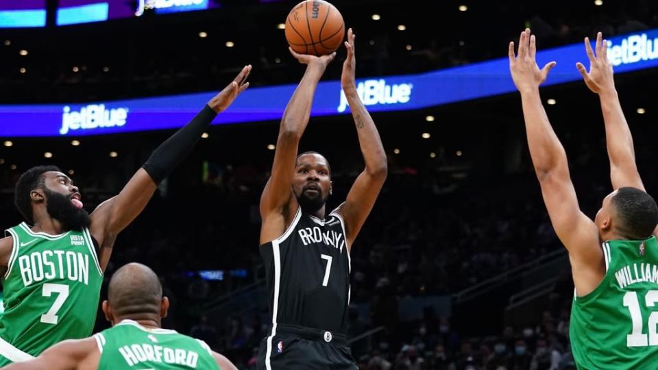 Kevin Durant jumper over two Celtics black uniform