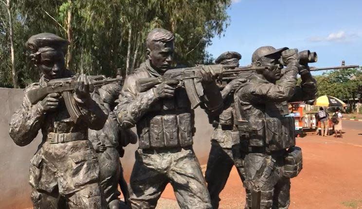 A statue in Bangui, Central African Republic, stands in honor of the Russian mercenaries of the Wagner Group, which portrays itself as a protector of the country while plundering its resources for profit. / Credit: CBS News