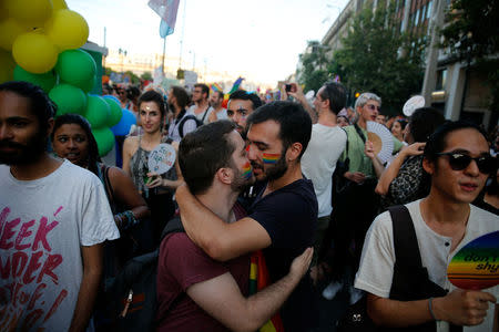 Two men kiss during a Gay Pride parade in Athens, Greece June 9, 2018. REUTERS/Costas Baltas