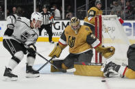 Vegas Golden Knights goaltender Adin Hill (33) blocks a shot by the Los Angeles Kings during the third period of an NHL hockey preseason game Wednesday, Sept. 27, 2023, in Las Vegas. (AP Photo/John Locher)