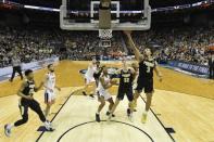 Mar 30, 2019; Louisville, KY, United States; Purdue Boilermakers guard Carsen Edwards (3) shoots as Virginia Cavaliers guard De'Andre Hunter (12) looks on during the second half in the championship game of the south regional of the 2019 NCAA Tournament at KFC Yum Center. Mandatory Credit: Jamie Rhodes-USA TODAY Sports