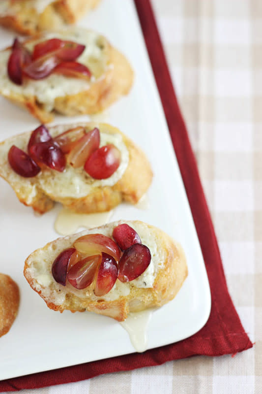 <p>Home Cooking Memories</p><p>The sweetness of grapes pairs so well with the tangy flavor of blue cheese.</p><p><strong>Get the recipe: <a href="https://homecookingmemories.com/grape-crostini-with-blue-cheese-spread-honey/" rel="nofollow noopener" target="_blank" data-ylk="slk:Grape Crostini with Blue Cheese Spread;elm:context_link;itc:0;sec:content-canvas" class="link ">Grape Crostini with Blue Cheese Spread</a></strong></p>