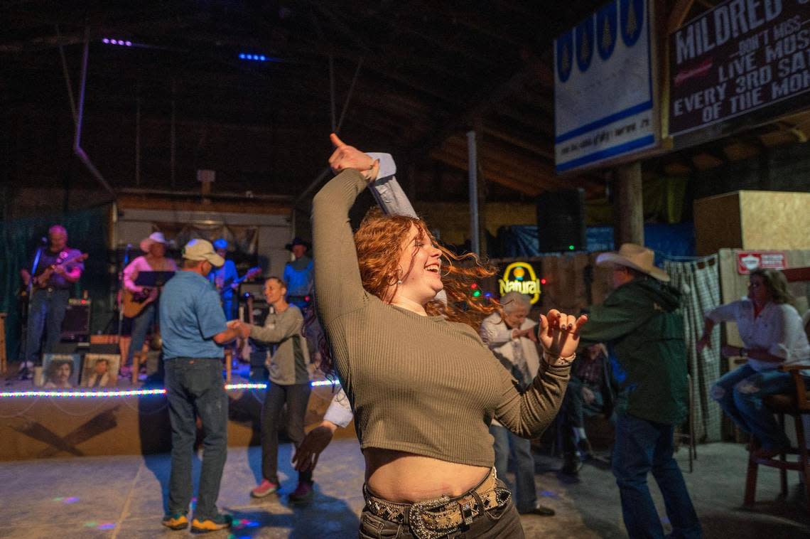 Nineteen-year-old Alexa Fuhrman spins with a partner at the Saturday night dance in Mildred.