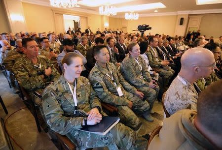 FILE PHOTO - U.S. Army members and multinational officials attend the third annual international conference on countering Islamic State propaganda in Baghdad, Iraq December 13, 2017. REUTERS/Thaier Al-Sudani