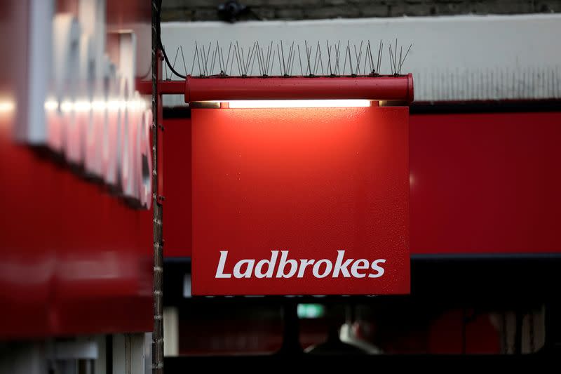 FILE PHOTO: FILE PHOTO: A sign hangs outside a branch of Ladbrokes in London