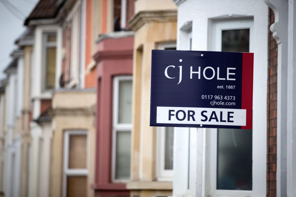 A estate agent’s board is seen outside a property on October 8, 2014 in Bristol, England. Photo: Matt Cardy/Getty Images