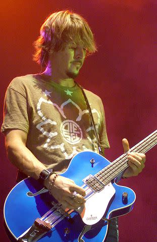 <p>Paul Hawthorne/WireImage</p> Charlie Colin playing with Train in 2003.