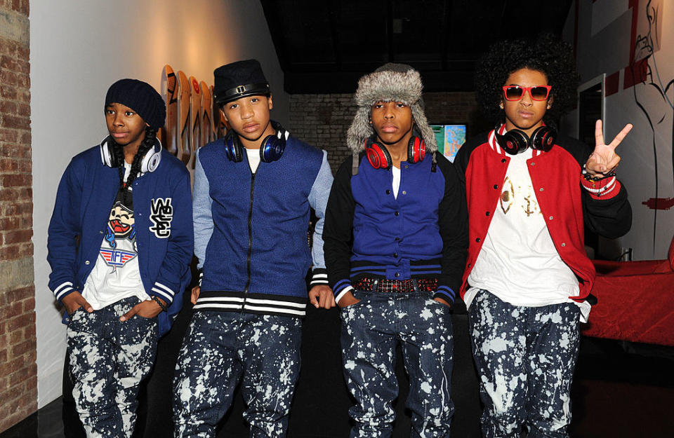 a group of men wearing beats by dre headphones