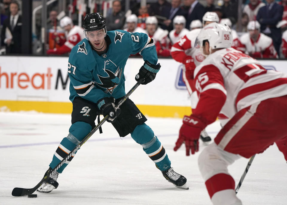 San Jose Sharks right wing Joonas Donskoi (27) moves the puck past Detroit Red Wings defenseman Niklas Kronwall (55) during the first period of an NHL hockey game Monday, March 25, 2019, in San Jose, Calif. (AP Photo/Tony Avelar)