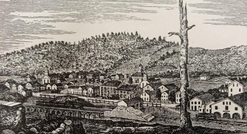 This is the earliest known rendering of Honesdale, done in 1843 and showing the wooden Wayne County courthouse in back. In the immediate foreground is the original Episcopal Church, and at far left is the former Presbyterian Church, both made of wood. Note how the artist shows Irving Cliff hidden by trees. Main Street (Front Street) is in view, as well as canal operations.