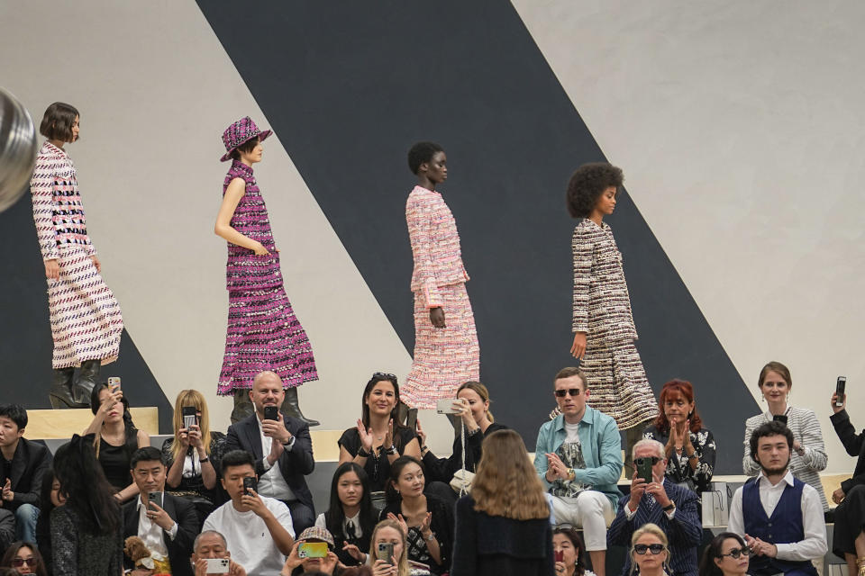 Models wear creations as part of Chanel's Haute Couture Fall/Winter 2022-2023 fashion collection presented Tuesday, July 5, 2022 in Paris. (AP Photo/Michel Euler)