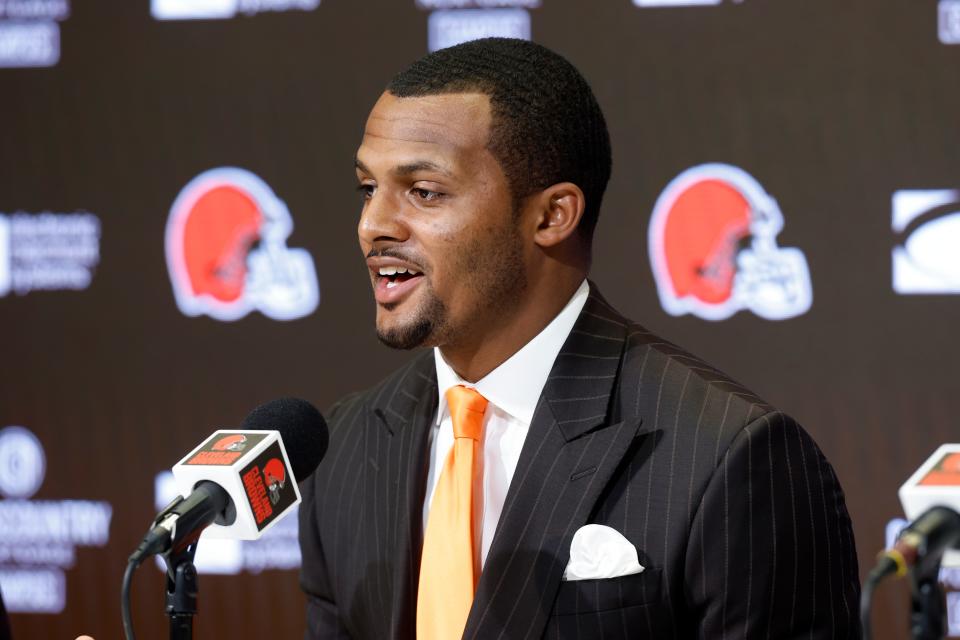 New Cleveland Browns quarterback Deshaun Watson speaks during a news conference at the NFL football team's training facility on March 25. The NFL is still investigating Watson whether he violated its personal-conduct policy.