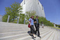 Mike and Becky Shamo, the parents of Aaron Shamo, walk from the federal courthouse Monday, Aug. 12, 2019, in Salt Lake City. Former Eagle Scout Aaron Shamo, 29, will stand trial on allegations that he and a small group of fellow millennials ran a multimillion-dollar empire from the basement of his suburban Salt Lake City home by trafficking hundreds of thousands of pills containing fentanyl, the potent synthetic opioid that has exacerbated the country's overdose epidemic in recent years. (AP Photo/Rick Bowmer)