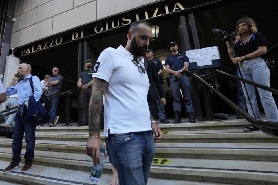 Gianluca Ardini, who survived to the Morandi bridge collapse, stands outside the Palace of Justice on opening of the first hearing of the trial, in Genoa, Italy, Thursday, July 7, 2022. Forty-three people were killed when a large stretch of the Morandi Bridge broke off, August 14, 2018, on the eve of one of Italy's biggest vacation holidays. (AP Photo/Antonio Calanni)