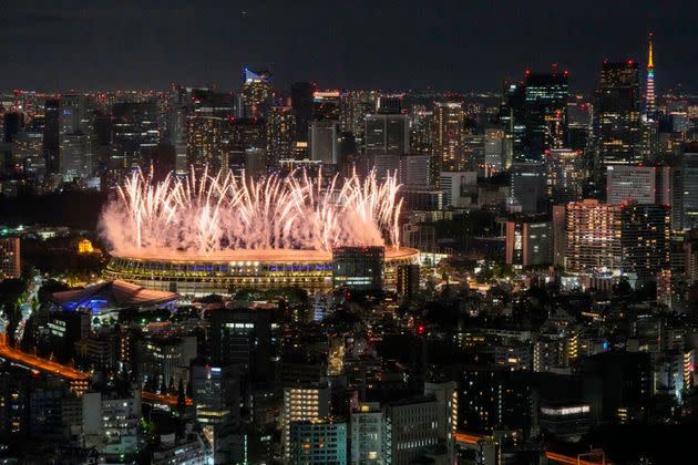 Fireworks illuminate over the National Stadium during the Tokyo Olympics opening ceremony. (Photo: via Associated Press)